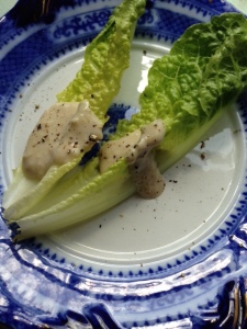 Caesar dressing on romaine lettuce on really pretty plate from Wales.